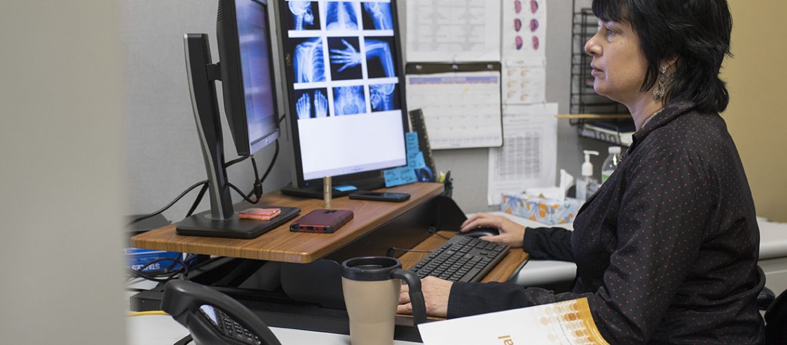 A medical coder works at her office in Tampa, Fla.