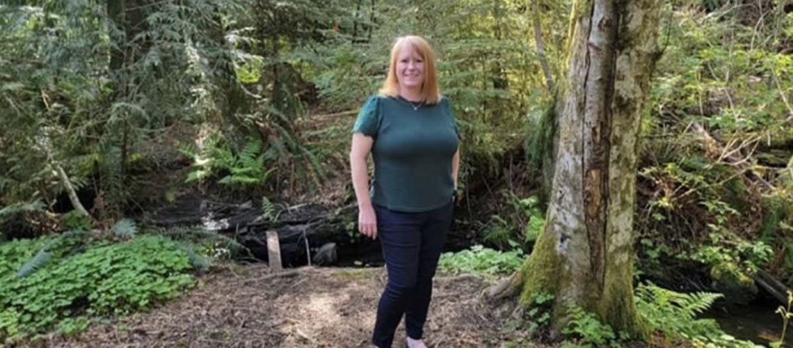 Woman Standing in Woods