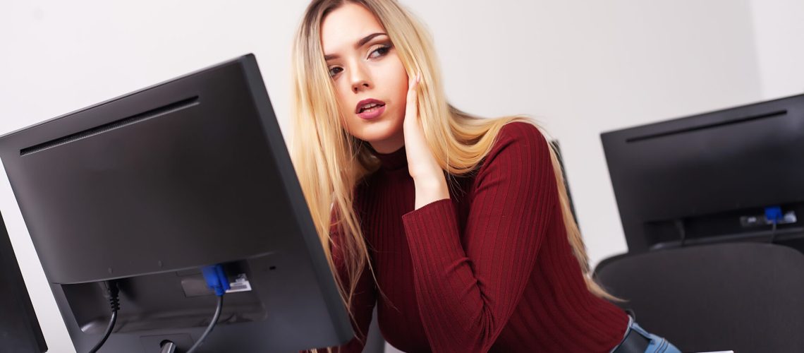 Beautiful Businesswoman suffering pain in her office