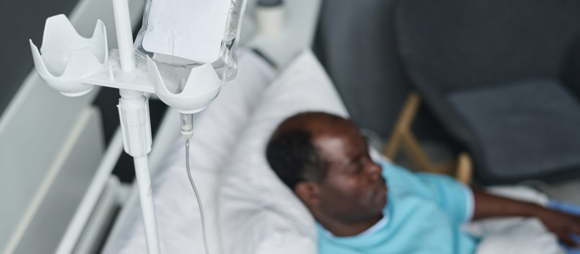 Patient with dropper lying in ward